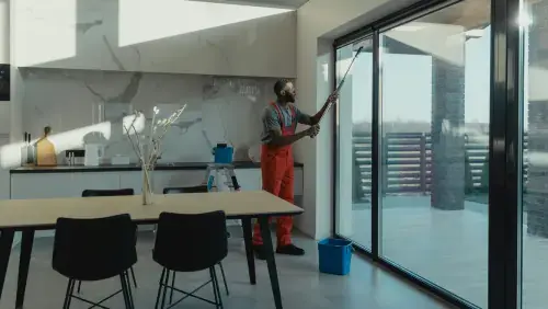 Professional window replacement services in New Jersey featuring large modern glass sliding doors and windows