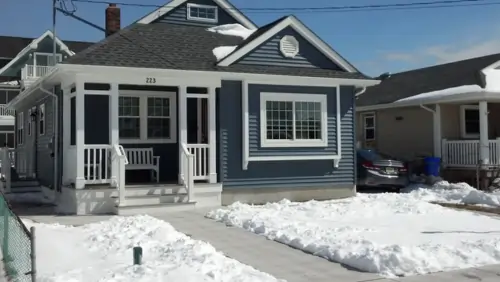 Modern exterior renovation in New Jersey by Tedesco Remodeling, featuring completed new siding and custom decks
