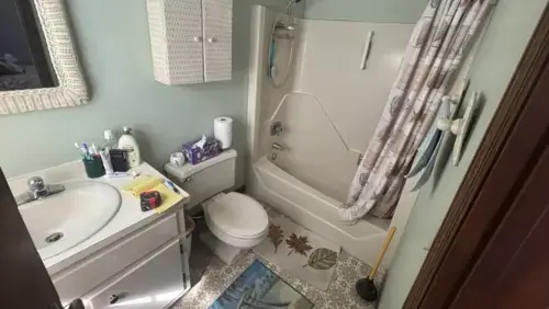 Complete bathroom renovation service in NJ by Tedesco Remodeling showing a full bathroom layout with toilet, sink, and shower