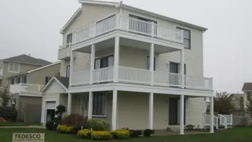 Completed multi-level deck renovation with new railings by Tedesco Remodeling in New Jersey